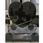 Angylion yn dal carreg fedd